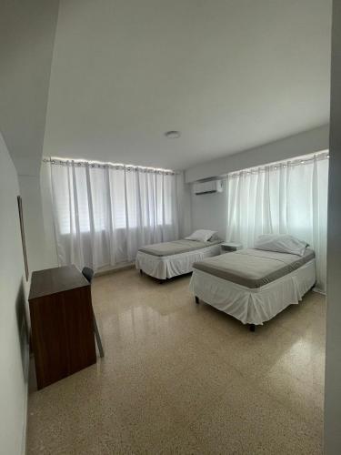 Habitaciones privadas en un departamento encantador in Obarrio