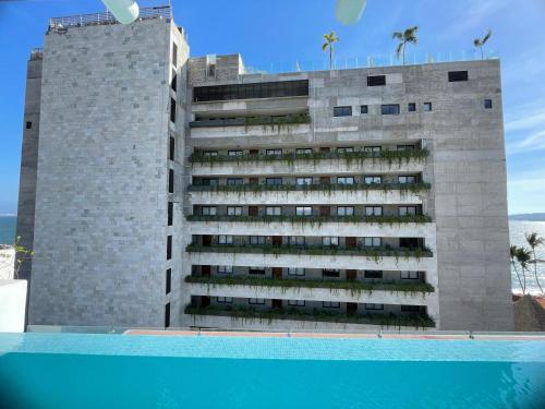Casa Las Palmas - Condos by the Beach with Rooftop Pool in Bucerías, Mexico