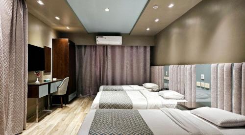 Grand Bayan Hotel & Apt at Nile Plaza - Tap to explore photos