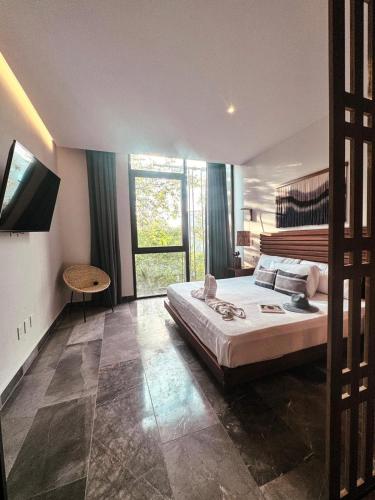 IIK Tulum by Groovy Stays- A Hip Condo-Hotel with WIFI, Rooftop, Pool, Sleeps 6 in Tulum, Mexico