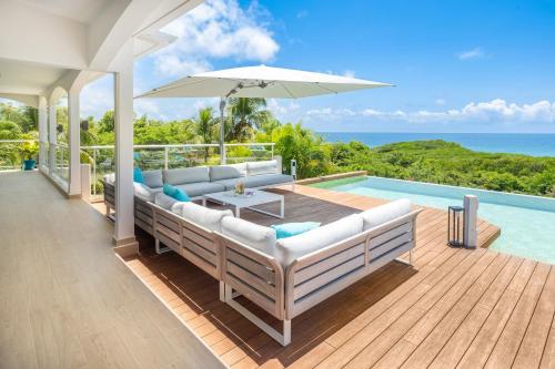 Фасада на хотела, Villa vue mer, piscine, plage 2 min à pied, 10 personnes (Villa vue mer, piscine, plage 2 min a pied, 10 personnes) in Mare Gaillard