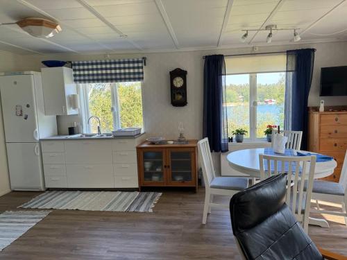 Majas Backe on a island with boat in Hammarland