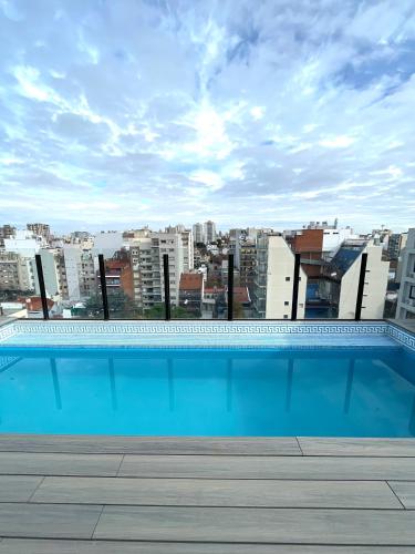 Swimming pool, Refugio otonal cozzy y super equipado con parrilla y terraza in Coghalan