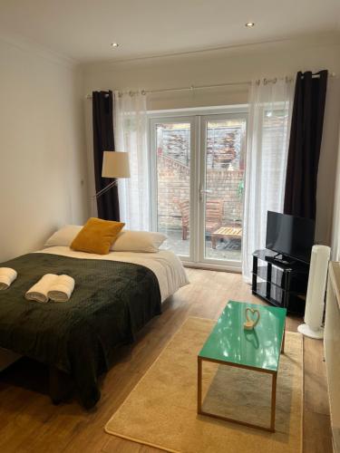 Charming 2-Bed Garden Flat near Kings Cross St Pancras & Emirates Stadium, London