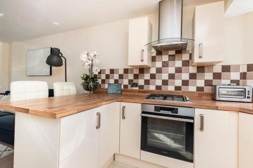 Kitchen, Three Bedroom Detached Home with Parking, Dog friendly, Quiet location, Short Drive to Beach! in Queen's Park