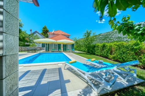 Exterior view of Villa Zupa with Heated Pool, Tennis Court & Mini Golf