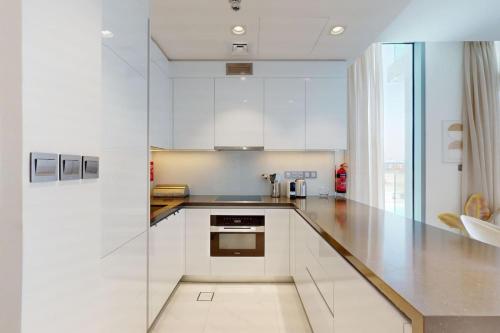 Vacationer Holiday Homes I Waterfront 1 Bedroom I Stunning Lagoon View I District One, Dubaj (fotografie 3)