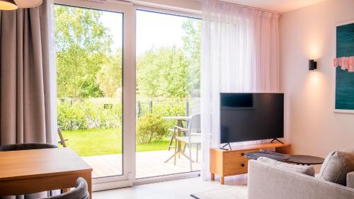 Apartament w willi z sauną i ogrodem SurfingBird Dźwirzyno