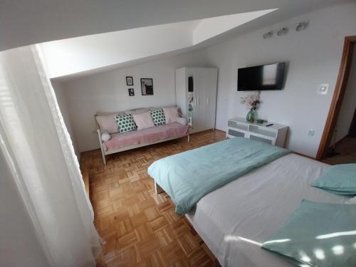 Two-Bedroom Apartment with Terrace room in Apartments Jolić