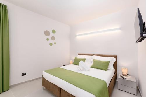 Koplietošanas atpūtas telpa ar TV, La Grignola Apartments in Castellinaldo