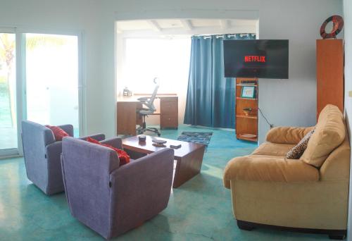 gedeelde lounge/tv-ruimte, Casa Lamanai in Punta Mita