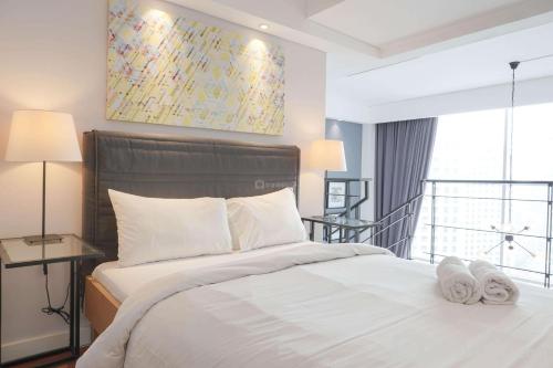 Comfort 1BR at CityLofts Sudirman Apartment By Travelio