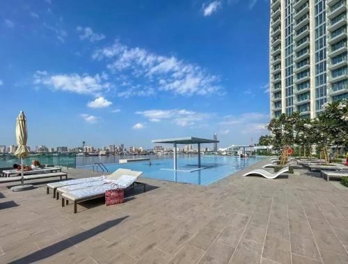 Swimming pool, Elegant Luxury Apartment with Stunning Lake Views in Dubai Creek Harbour By AYA Boutique in Dubai Festival City