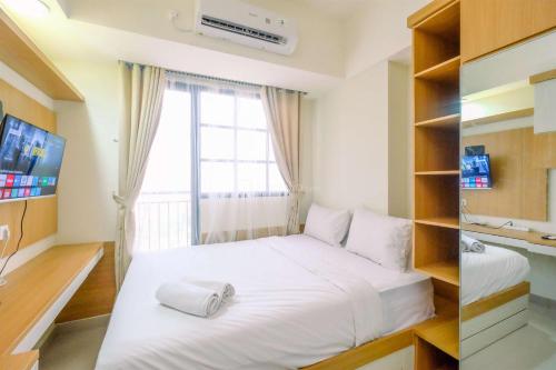 Two-Bedroom Apartment room in Good Choice and Strategic 2BR without Living Room Evenciio Apartment By Travelio