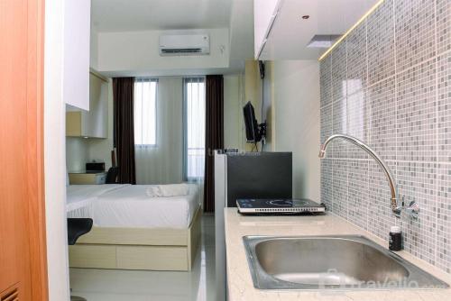 Studio Apartment room in Elegant and Nice Studio at Evenciio Margonda Apartment By Travelio