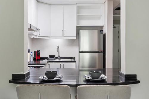 Kitchen, Chic studio near metro at Discovery Gardens near Bikanervala Al Furjan - Indian Vegetarian Restaurant in Dubai