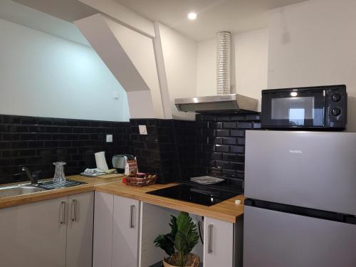 кухня, Coquet appartement à 15mn de Paris et 10 mn de Stade de France, wifi, Netflix, (Coquet appartement a 15mn de Paris et 10 mn de Stade de France, wifi, Netflix,) in Сан-Бріс-су-Форе