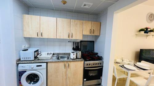 Kitchen, Spacious Furnished studio with balcony Spain cluster International city near Dubai International City