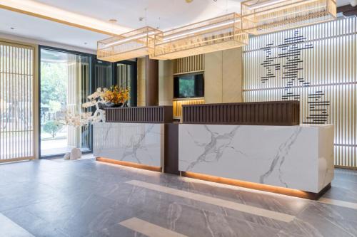 ردهة, Jianguo Puyin Hotel - Xi'an Big Wild Goose Pagoda University of Science and Technology Qujiang Campu in شرق المدينة