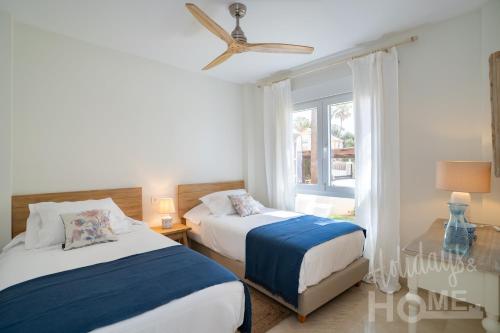 Holidays & Home Beachfront Neptuno III , sea views,and garden,Elviria - Tap to explore photos
