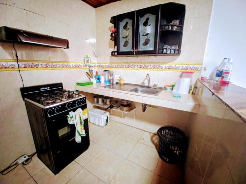 Kitchen, Casa Pupo Hostal in Torices