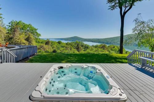 Hot Tub While Taking In Lake Front View in Neiplsa (NY)