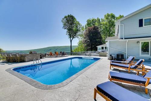 Hot Tub While Taking In Lake Front View in Neiplsa (NY)