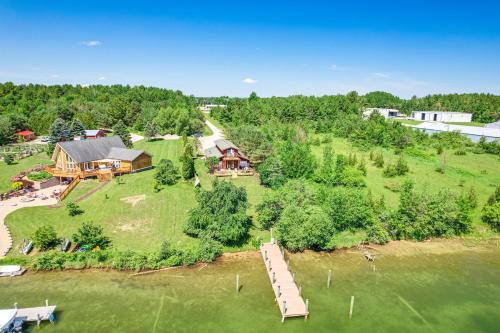Riverfront Cheboygan Home with Dock about 4 Mi to Town!
