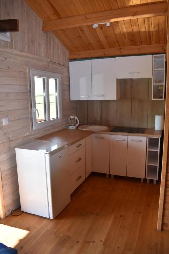 Domki nad stawem in Paprotki