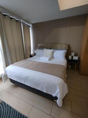 Cozy 1BR UPTOWN PARKSUITES Tower1 BGC, Cainta