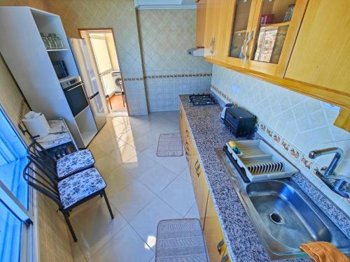 Kitchen, Appartement plus que parfait in Bni Makada