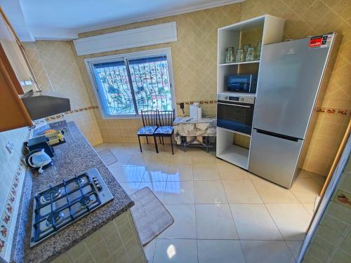 Kitchen, Appartement plus que parfait in Bni Makada