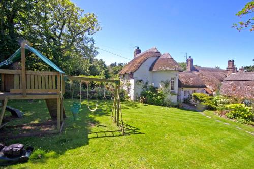 Putsborough Manor 3 Self Catering Cottages with Beach a short walk dog friendly all year, On site Tennis, Play Area, Paddock, Spa baths, BBQ, Private Gardens, Superfast WIFI