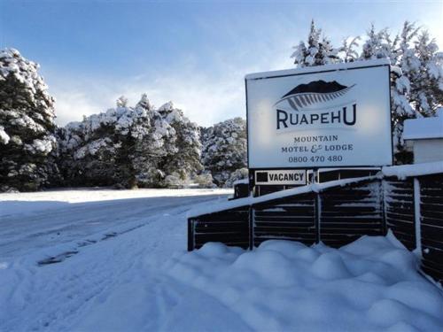 a sign on the side of a snow covered road, Ruapehu Mountain Motel & Lodge in Ohakune