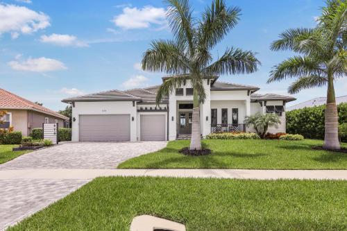 Modern Home with pool and steps to beach, food and fun