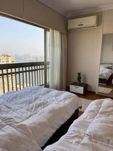 Zamalek Nile Panoramic View 3BR - Tap to explore photos