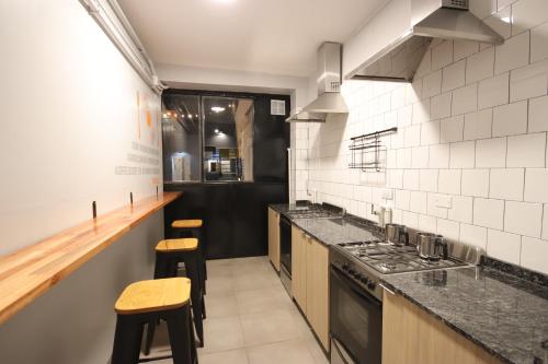 Kitchen, Play Hostel Garden in Palermo
