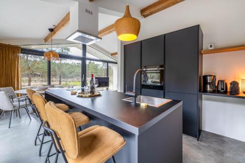 Design bungalow met wellness in parkbos in Buurtschap Giethmen