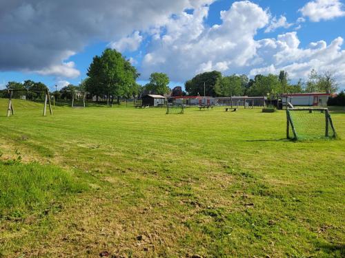Játszótér, Holiday Home Friesland near the Wadden Sea with Wifi and 3 Bedrooms in Tzummarum