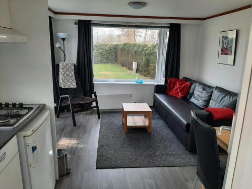 Chalet dichtbij zee en duinen in ฮีมซเกิร์ก