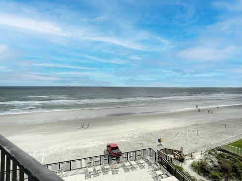 Ocean View with a beachfront pool at Ocean Trillium Condo 504 in New Smyrna Beach, USA