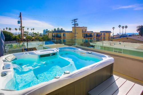Ocean-view home blocks to beach with private hot tub & rooftop deck