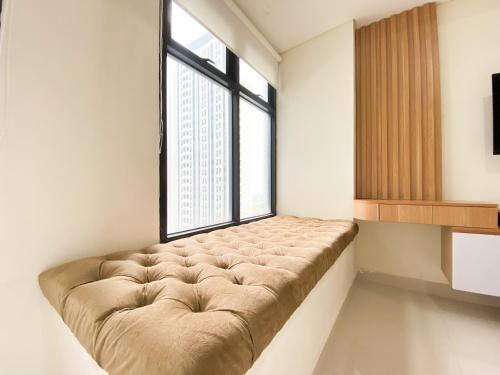 Simply Studio at Pollux Chadstone Apartment By Travelio