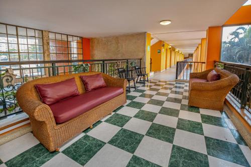 Hotel Palmarena Plaza - Tap to explore photos