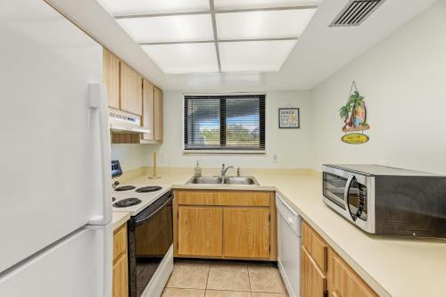 Ocean View with a beachfront pool at Ocean Trillium Condo ~ 103 in New Smyrna Beach, USA