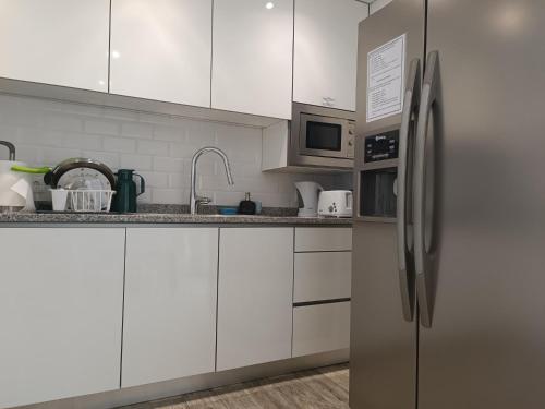 ห้องครัว, Cachinnans Hostel & Apartments in วิลลา โด คอนเด