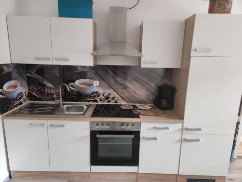 ห้องครัว, TOR STAY - Charmante 2 Zimmer Apartment in อันสบัค