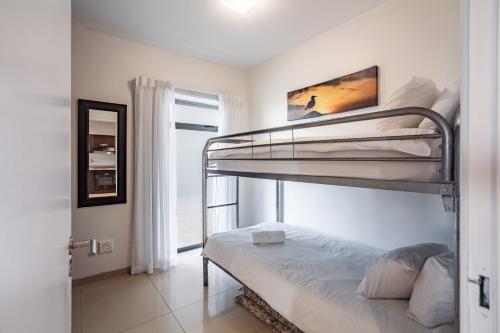 Modern Beachfront with Ocean Views - Infinity G9, Blouberg, Cape Town - Tap to explore photos