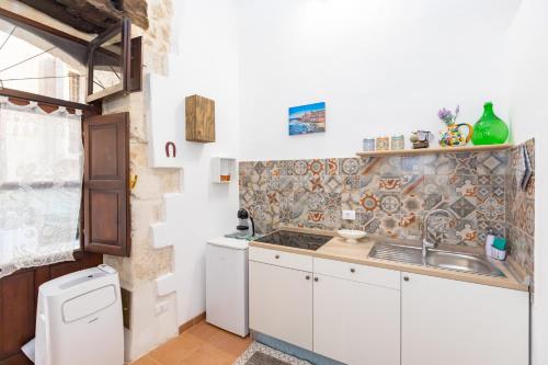 Kitchen, Casa Ariadne by Ortigia Apartments in Syracuse