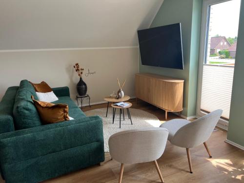 Jagatud salong / TV-ala, Grünblick Oase No1 Ferienwohnung Wiesmoor (Grunblick Oase No1 Ferienwohnung Wiesmoor) in Wiesmoor